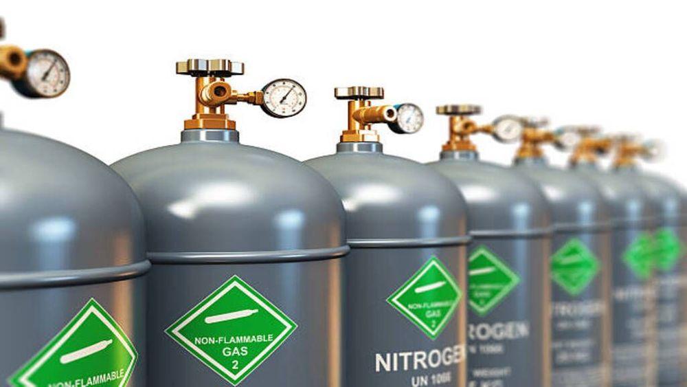 High-pressure nitrogen gas cylinders with gauges, used for inflating tyres due to nitrogen's stability and pressure retention benefits.